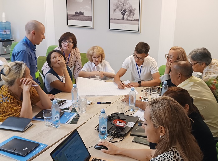 Training participants discussing a field-assessment exercise in Kazakhstan.