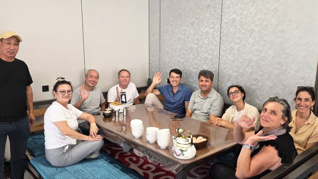Workshop participants on the way to Issyk-Kul stopped to have tea with famous traditional Kyrgyz kattama bread