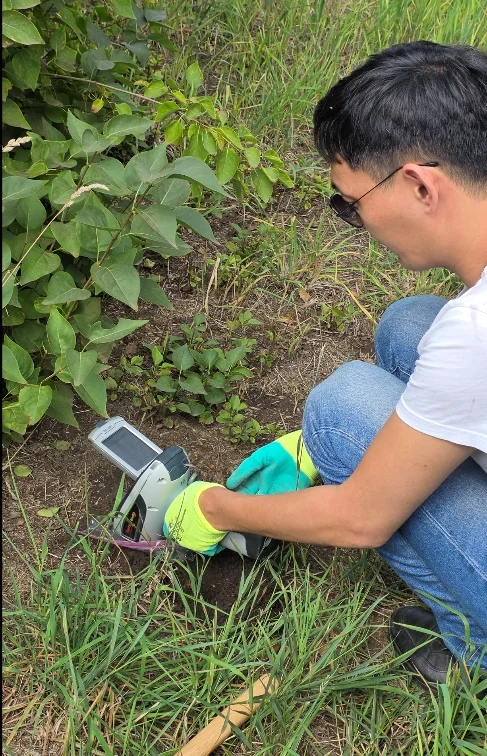 Testing soil in a park

